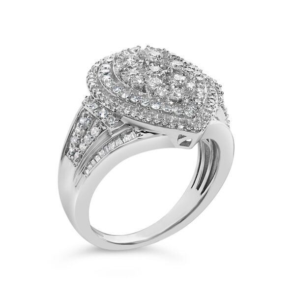 Close-up of round diamonds set in prongs at the center of a pear-shaped cluster ring