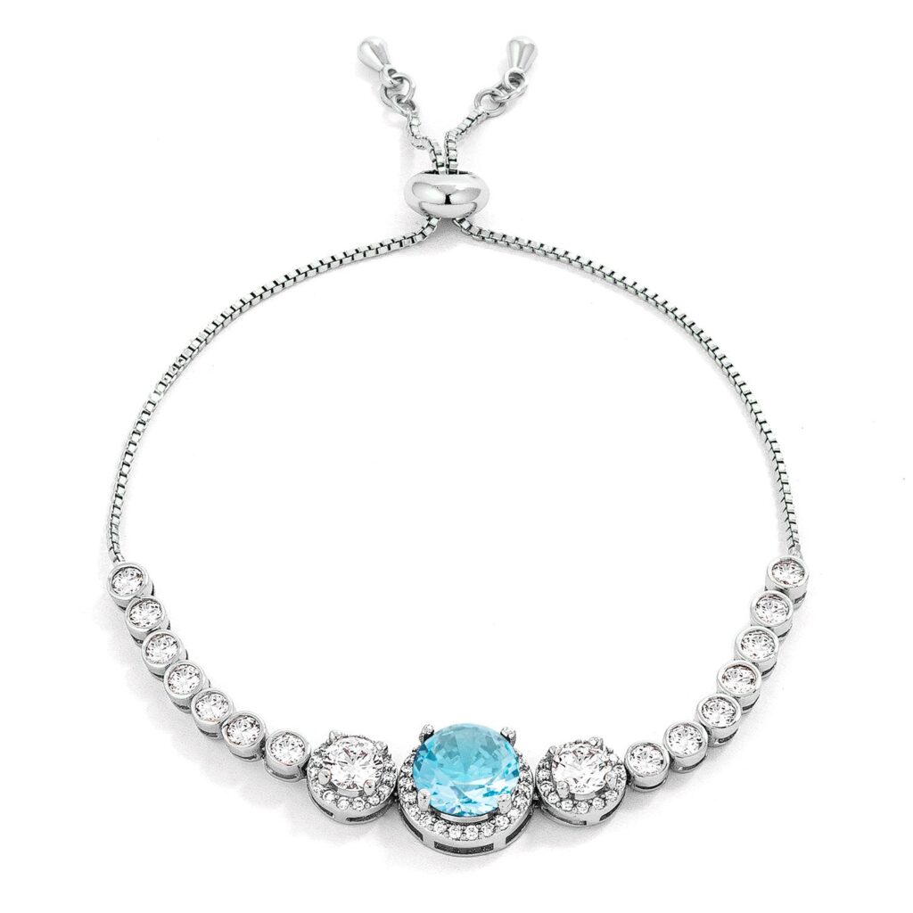 Graduated light aqua and clear round cubic zirconia bolo style tennis bracelet in silver tone over lead free alloy (brass).