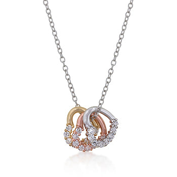 Tri-tone heart cluster necklace in 18K plated yellow gold over yellow gold.