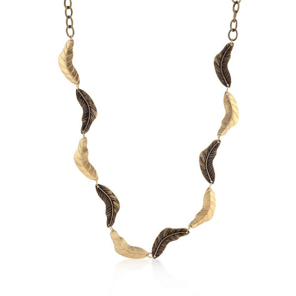 The necklace in worn gold finish over lead-free alloy (white metal).