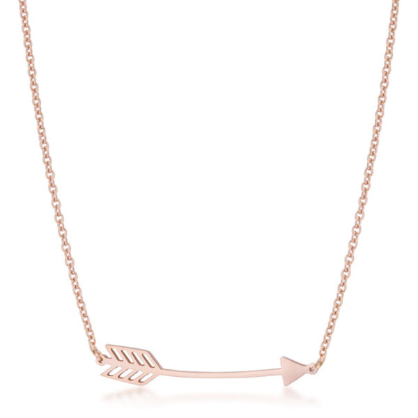 Arrow pendant necklace in rose goldtone plated stainless steel laid flat on display