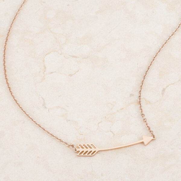 Full length view of the 16 inch rose goldtone chain with arrow pendant