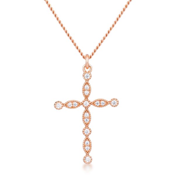 Vintage cross pendant in rose gold plated over brass with clear cubic zirconia.