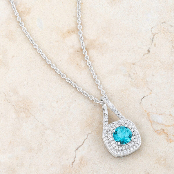 Round aqua cubic zirconia necklace with an 18 Inch Chain + 2 Inch Extender.