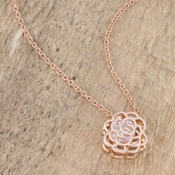 Cubic zirconia rose drop pendant in rosegold plated over lead free alloy (brass), with an 18-inch chain and 2-inch extender.