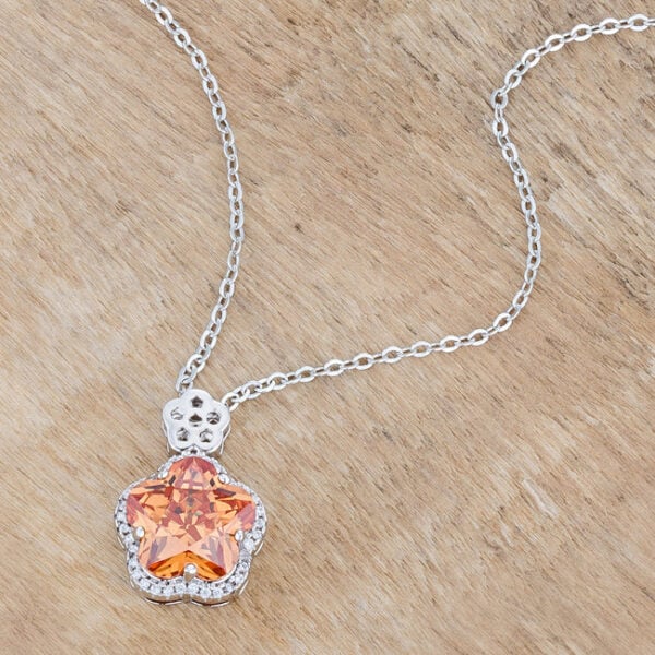 Flower-inspired champagne cubic zirconia pendant with a rhodium plated finish.