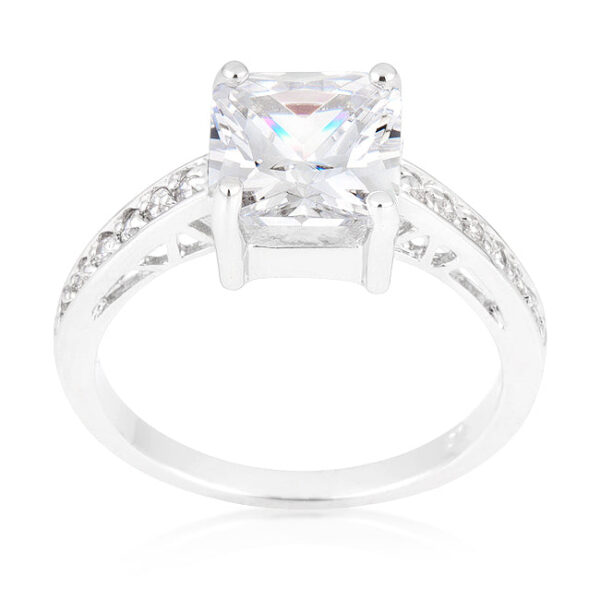 Clear princess-cut cubic zirconia in prongs on a rhodium plated over lead free alloy (brass) ring with 1.6 Mm width.