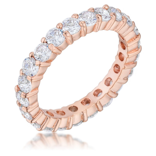 Anniversary band ring with round cubic zirconia in prongs and rose gold tone finish over lead free alloy (brass).