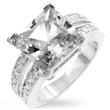 Clear Princess cut cubic zirconia ring in prongs, rhodium plated over lead free alloy (brass), with 7.4 ct total stone weight.