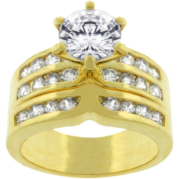 Formal engagement ring with round simulated cubic zirconia in a channel setting, gold tone finish over lead free alloy (brass), and rhodium prongs.