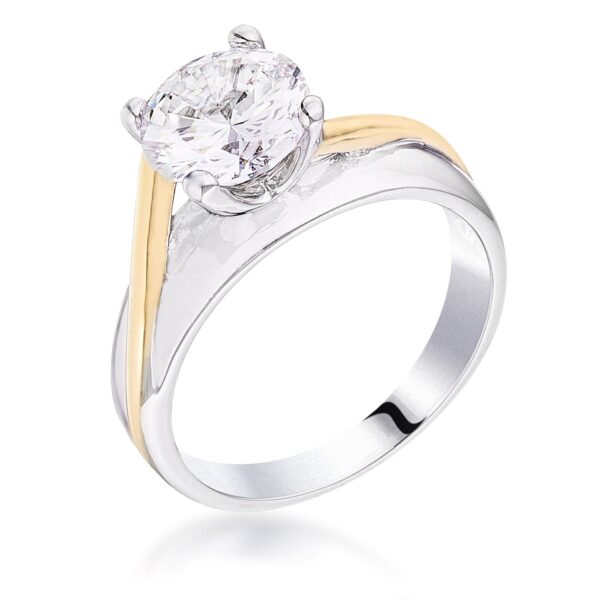 Two-tone solitaire ring in gold tone over lead free alloy (brass) with a clear round cubic zirconia in prongs.