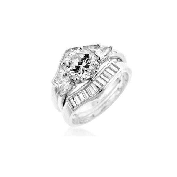 The ring with turquoise-coloured cubic zirconia in a channel setting and rhodium plated over lead free alloy (brass).