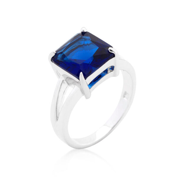 Blue sapphire-colored cubic zirconia gypsy ring in rhodium plated over lead free alloy (brass), with a princess cut and prongs.