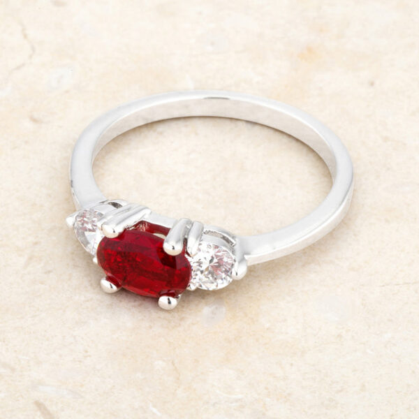 Rhodium plated over lead free alloy (brass) ring with oval-cut garnet-colored cubic zirconia and 1.2 ct total weight.