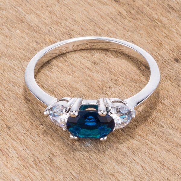 Three genuine oval cubic zirconia in prongs on a rhodium plated over lead free alloy (brass) bridal ring with a 2 Mm width.