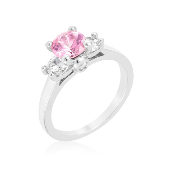 Pink 3-stone ring with round cubic zirconia in prongs, rhodium plated over lead free alloy (brass).