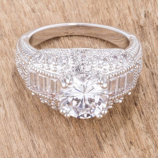Cubic zirconia ring in baguette and round cuts, rhodium plated over lead free alloy (brass).