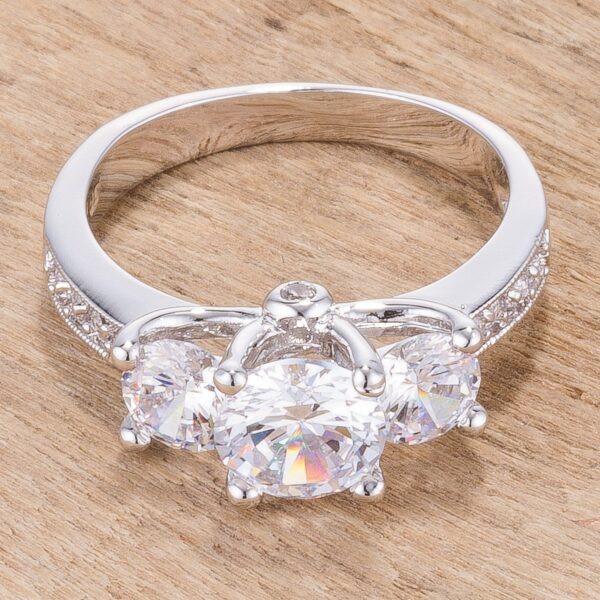 Round genuine cubic zirconia ring in prongs with 2.8 ct total stone weight and rhodium plated over lead free alloy (brass).