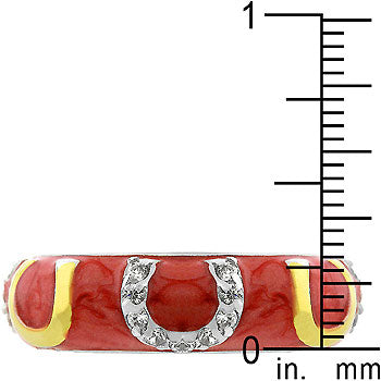 Gold tone over lead free alloy (brass) ring with pink enamel horseshoe design and cubic zirconia in prongs.