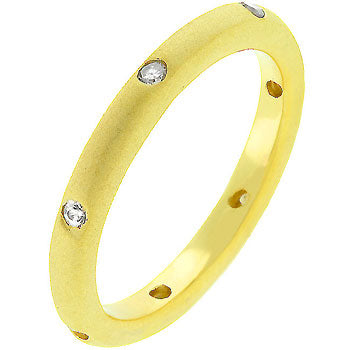 Wedding band with gold tone matte finish over lead free alloy (brass), round bezel-set cubic zirconia, and 0.07 ct total carat weight.