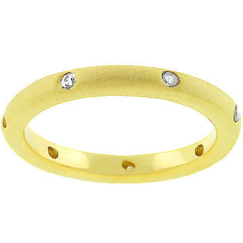 Contemporary wedding band in gold tone matte finish over lead free alloy (brass) with round cubic zirconia in bezel settings.