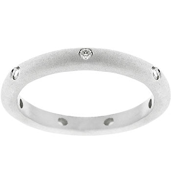 Round genuine cubic zirconia wedding band with a silver tone matte finish over lead free alloy (brass) and bezel settings.
