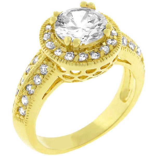 The ring with clear round cubic zirconia, a channel setting, and gold tone finish over lead free alloy (brass).