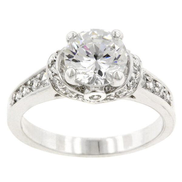 Rhodium plated over lead free alloy (brass) ring with pink round cubic zirconia in a bezel setting.