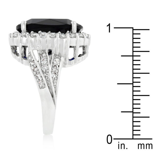 Engagement ring with sapphire-colored cubic zirconia in prongs.