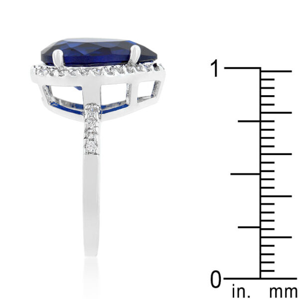Drop ring with sapphire-colored cubic zirconia, round cuts, and rhodium plated over lead free alloy (brass).