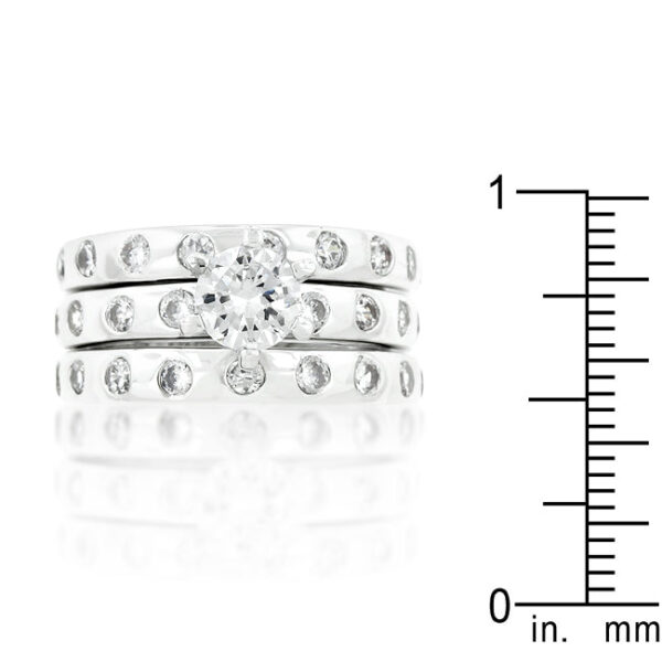 Round cubic zirconia bezel-set wedding ring set in rhodium plated over lead free alloy (brass).