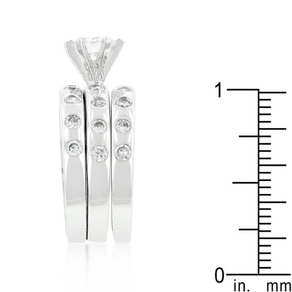Engagement ring set with bezel-set round cubic zirconia, rhodium plated over lead free alloy (brass).