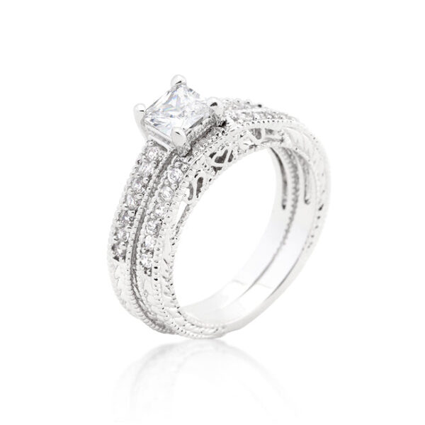 The ring with orange cubic zirconia, prong settings, and rhodium plated over lead free alloy (brass).