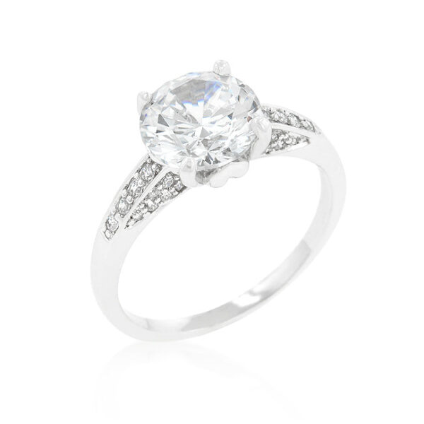 Contemporary engagement ring in rhodium plated over lead free alloy (brass) with round cubic zirconia in prongs.