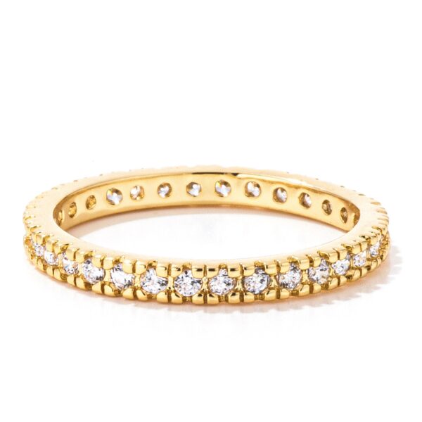 Gold Tone simple eternity band with clear round cubic zirconia in a pave setting.
