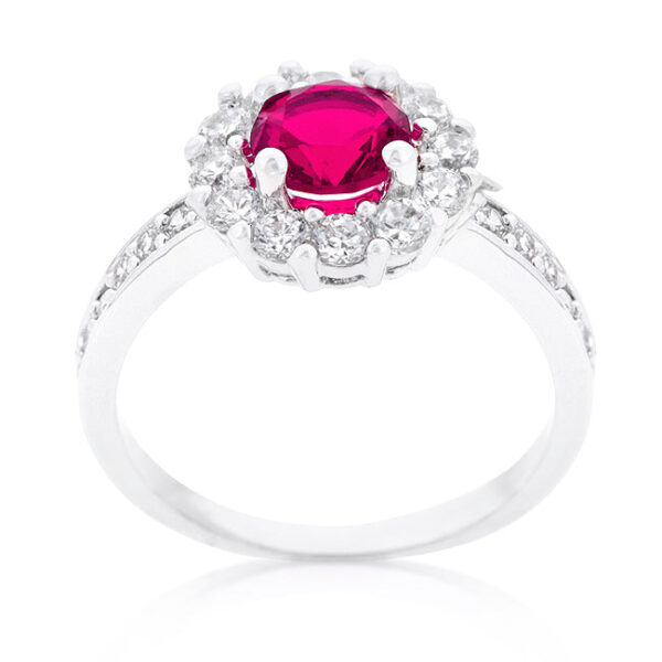 Round pink cubic zirconia in prongs on a rhodium plated over lead free alloy (brass) engagement ring.