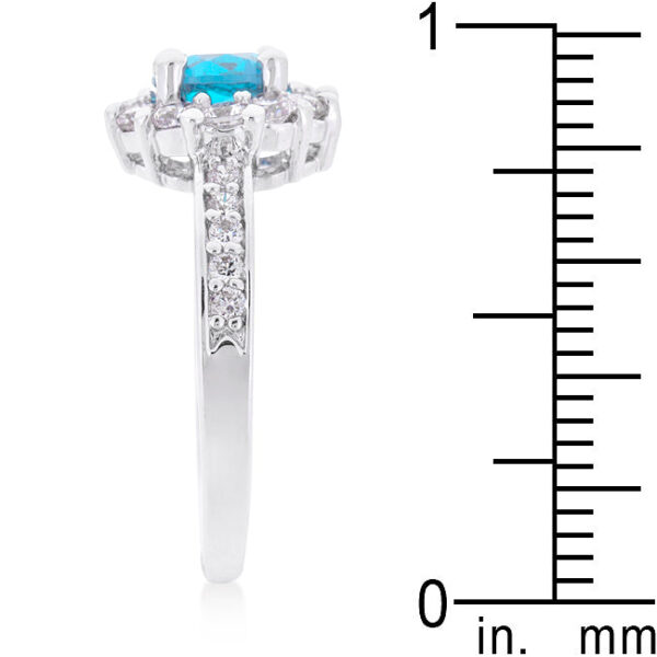 Rhodium plated over lead free alloy (brass) ring with blue round cubic zirconia in prongs.