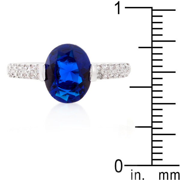 Engagement ring with blue oval cubic zirconia, a bar setting, and 2 Mm width.