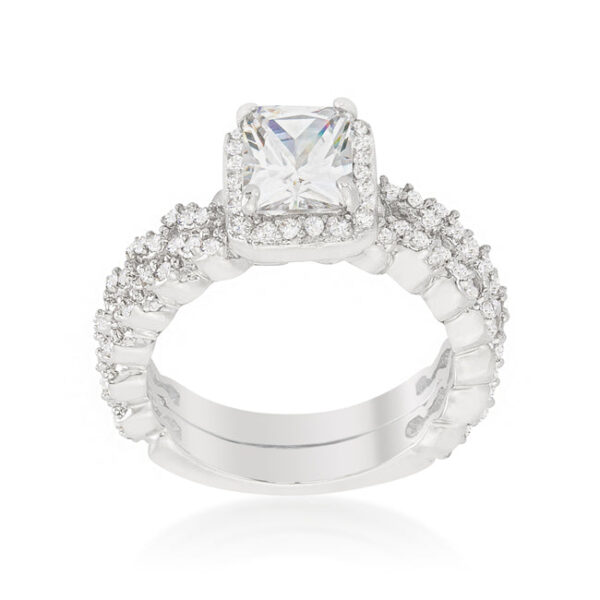 Wedding set in rhodium plated over lead free alloy (brass) with 2.4 ct total stone weight and prong-set cubic zirconia.