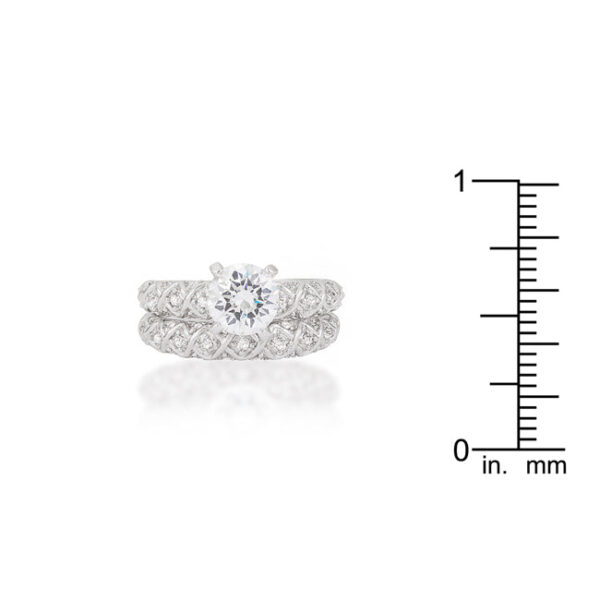 Pink round cubic zirconia engagement wedding set, rhodium plated over lead free alloy (brass), with a 5.4 Mm width.
