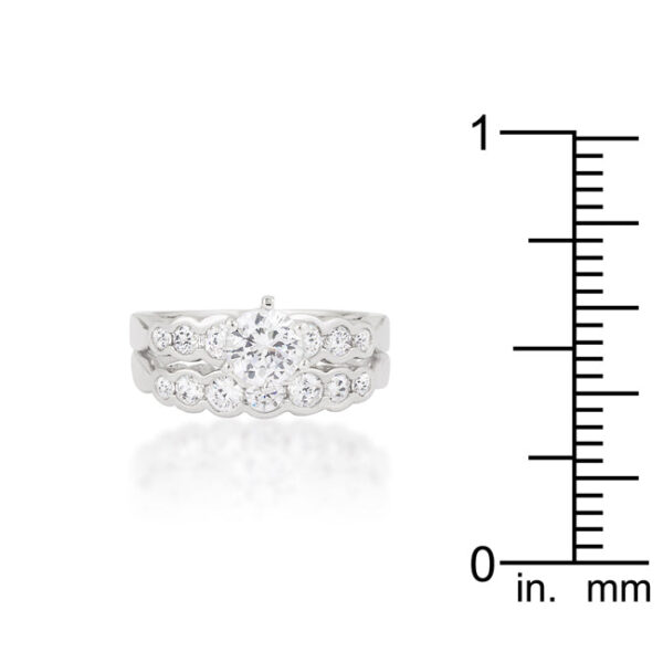 Graduated engagement wedding set with round cubic zirconia, prong settings, and a 3.4 (mm) width.