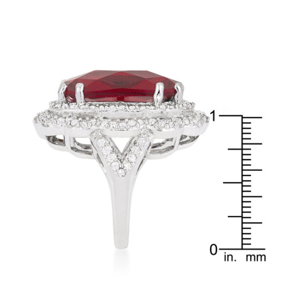 Red crest ring with faceted cubic zirconia in prongs and a 2.5 Mm width.