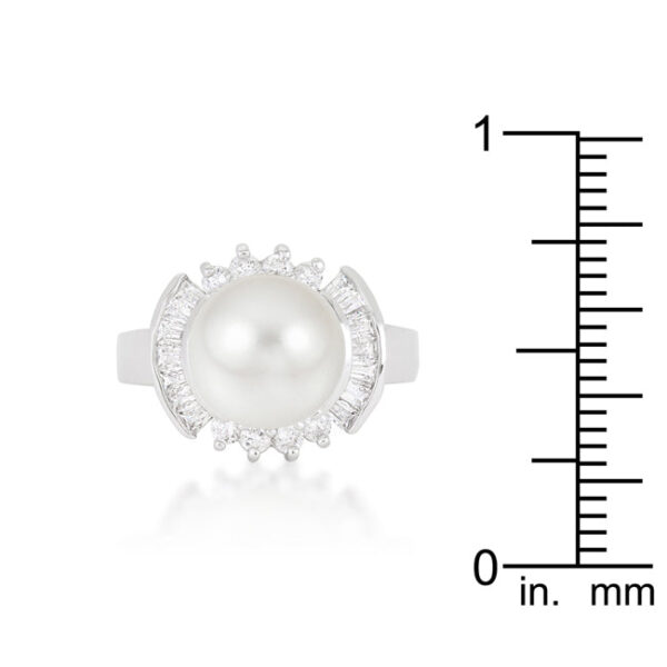 Bridal ring with cubic zirconia in baguette and round cuts, a simulated pearl, and a channel setting.