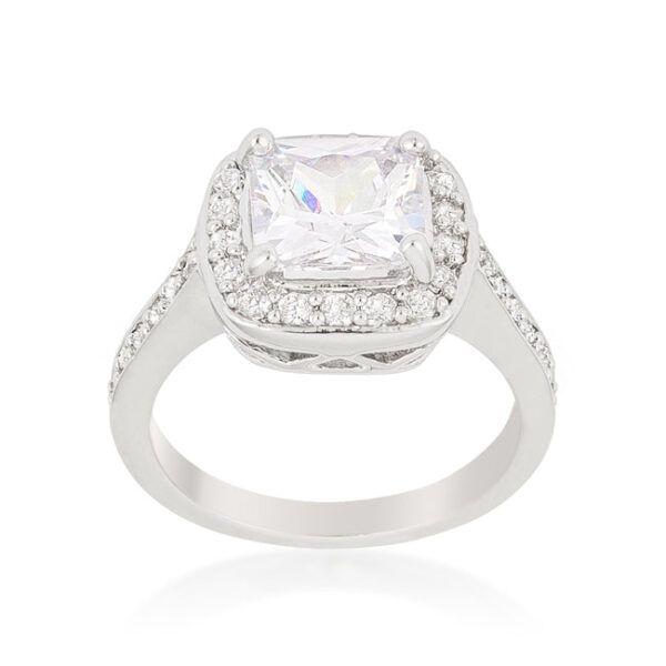 Rhodium plated over lead free alloy (brass) halo-style engagement ring with cushion-cut cubic zirconia and a prong setting.