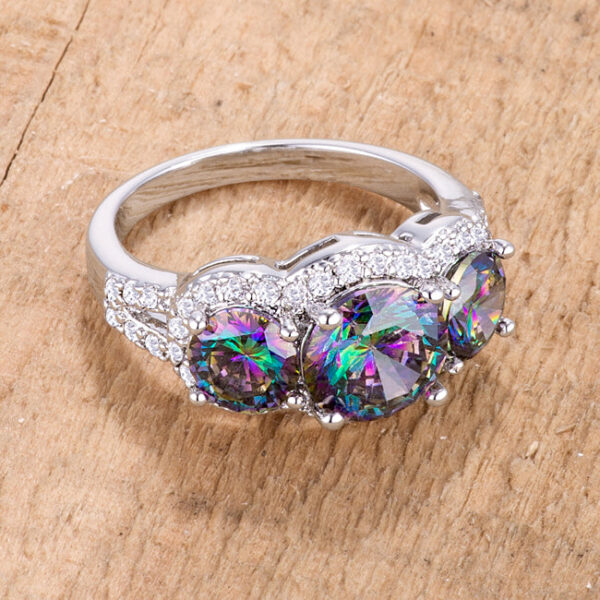 Classic three-stone ring with round mystic and clear cubic zirconia, 4 ct total stone weight, in prong settings.