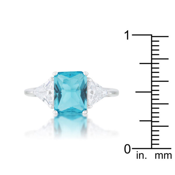 Trillion-cut, blue topaz-colored cubic zirconia in prongs on a rhodium plated over lead free alloy (brass) ring.