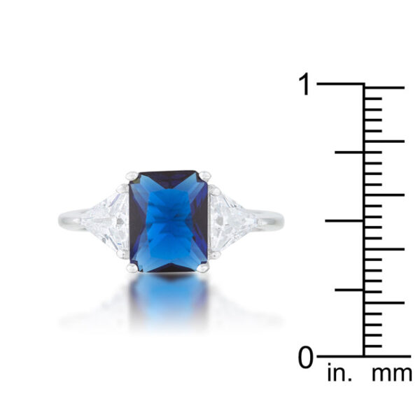 Radiant-cut genuine sapphire-colored cubic zirconia in the ring’s prong setting.
