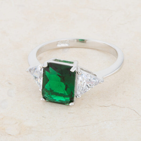 Prong-set radiant-cut emerald-colored cubic zirconia ring, rhodium plated over .925 sterling silver.