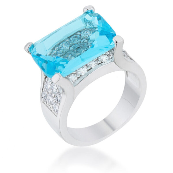Aqua cocktail ring with round cubic zirconia in prongs and a rhodium plated over lead free alloy (brass) band