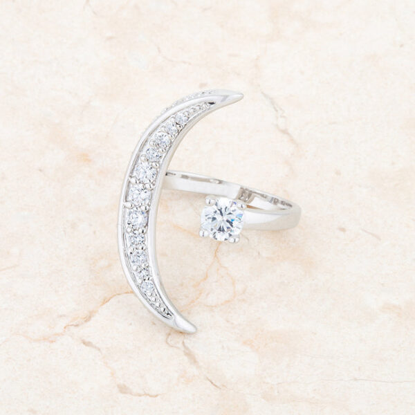 Luna ring with round cubic zirconia in prongs and rhodium plated over lead free alloy (brass).